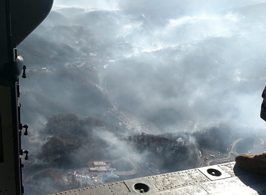 An aerial shot of the wildfires in Sevier county taken from a Tennessee National Guard helicopter on Nov. 29, 2016. The fires burned hundreds of acres and destroyed several buildings in Gatlinburg. (Photo by Staff Sgt. William Jones)