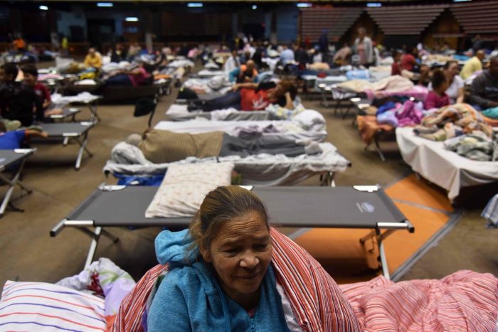 Puerto Ricans take refuge at the Roberto Clemente Coliseum in San Juan ahead of Hurricane Maria on Sept. 19. Hector Retamal / AFP - Getty Images