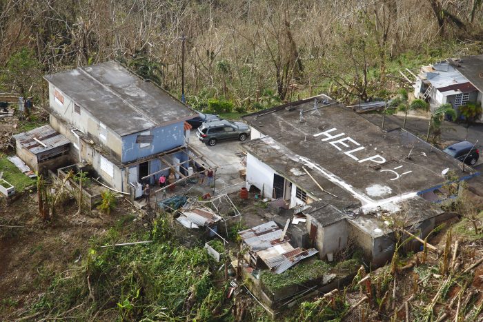 While conducting search and rescue in the mountains of Puerto Rico a CBP Air and Marine Operations Black Hawk located this home with HELP painted it is roof. Credit: U.S. Customs and Border Protection