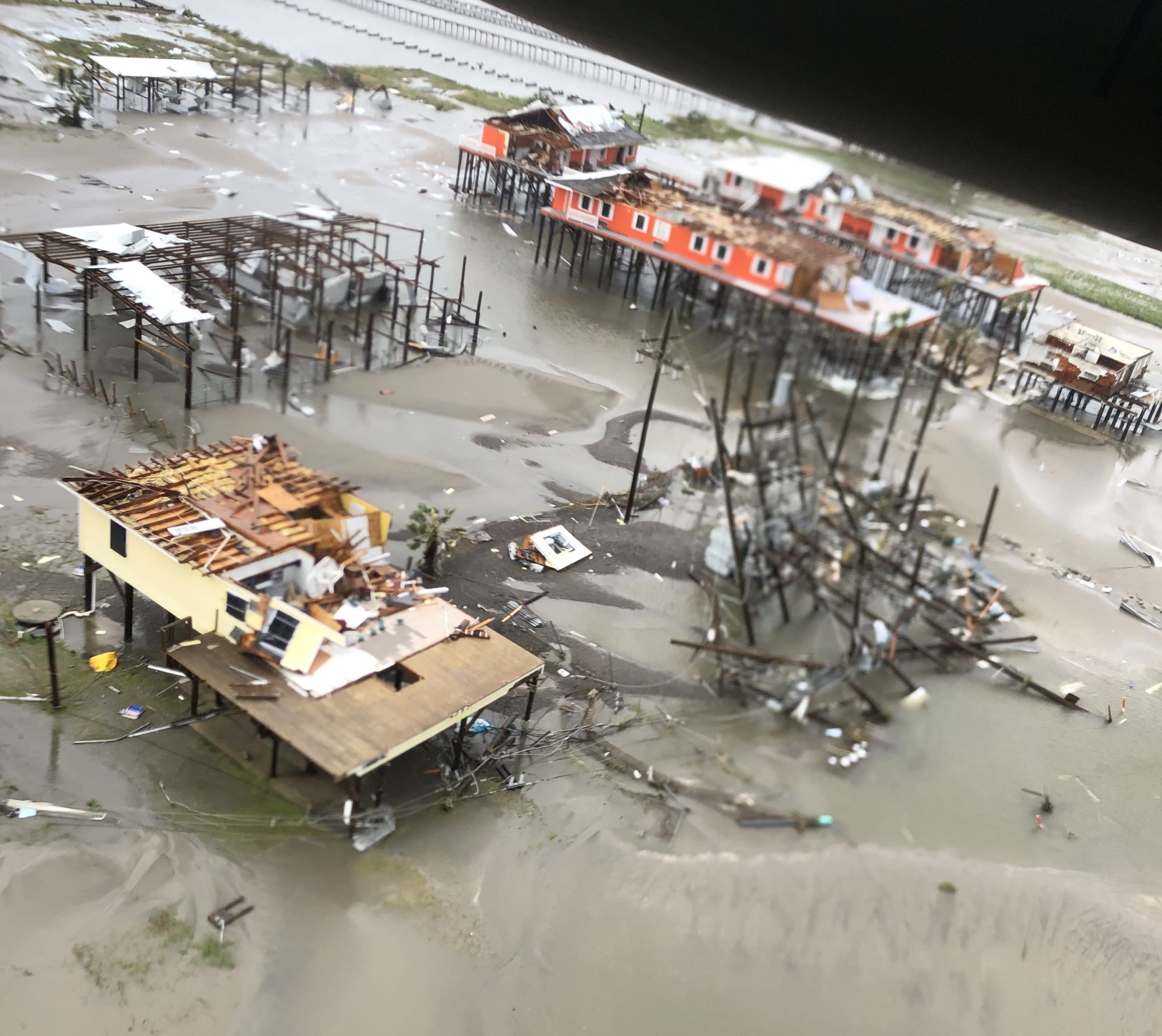 Photo taken from a helicopter showing homes damaged and destroyed by Hurricane Ida.