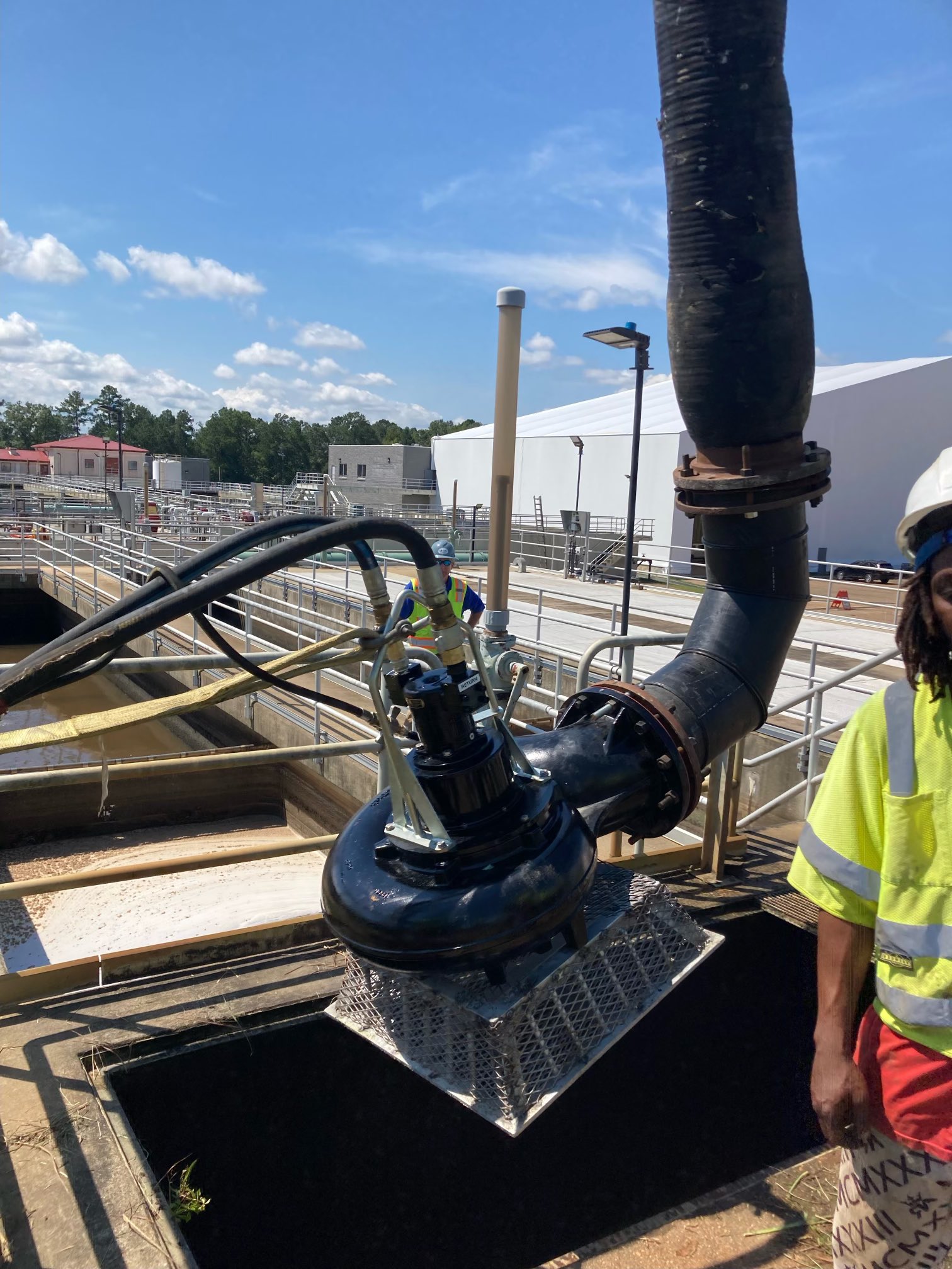 Workers installing an emergency rental pump in Jackson, Mississippi's water treatment plant