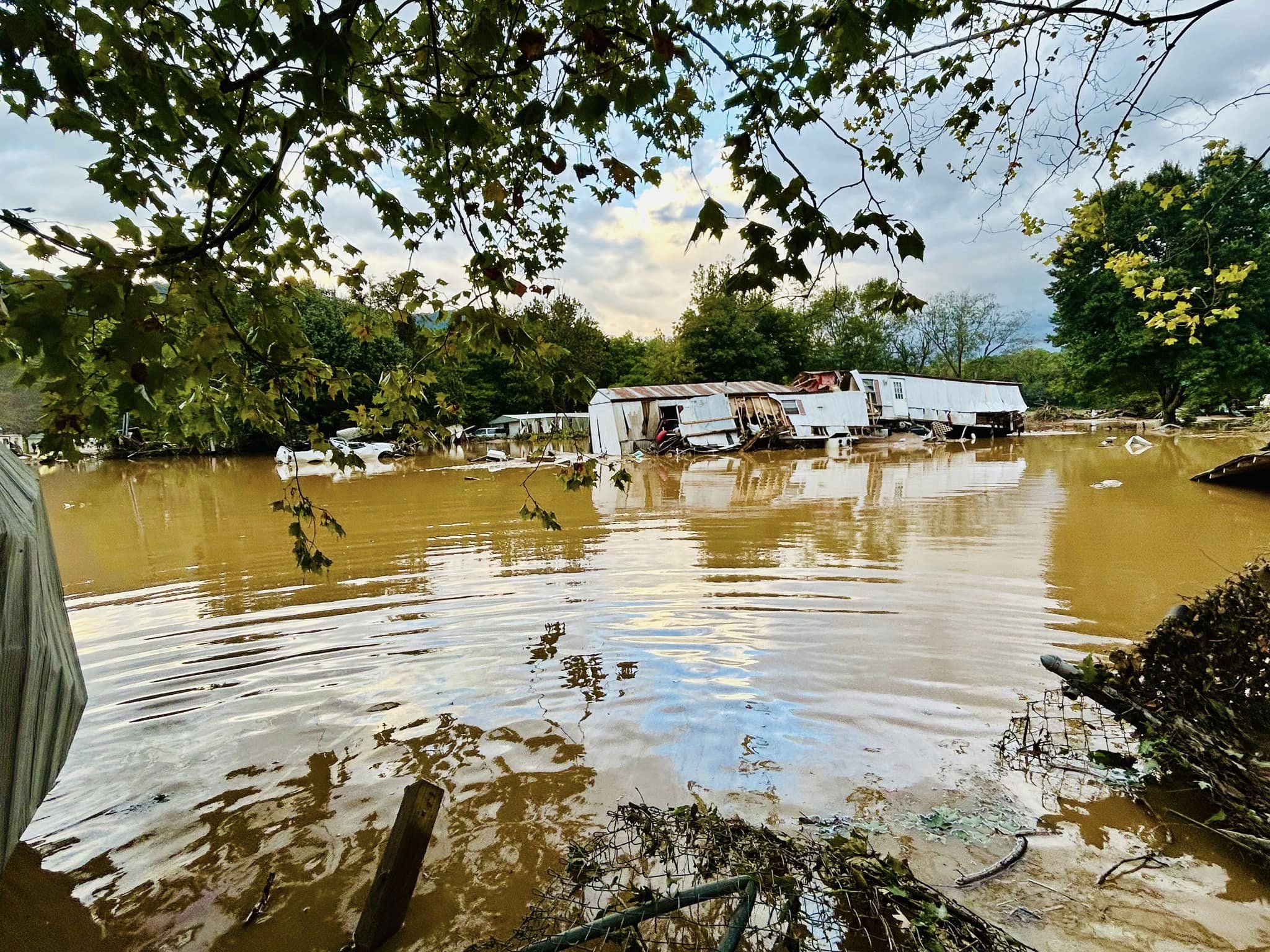 Damaged mobile homes in a flooded neighborhood