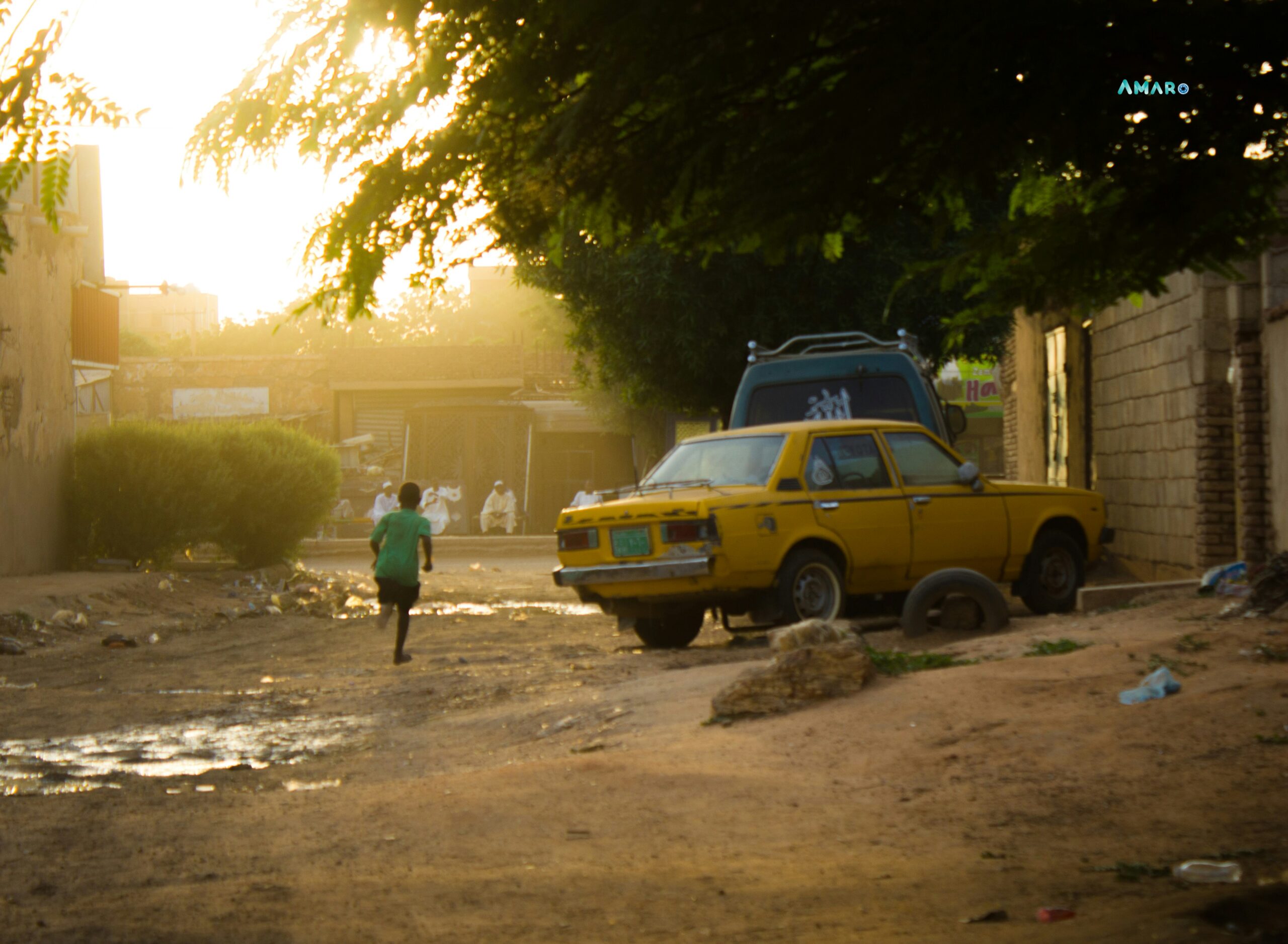 A boy running down a street in Khartoum, Sudan.